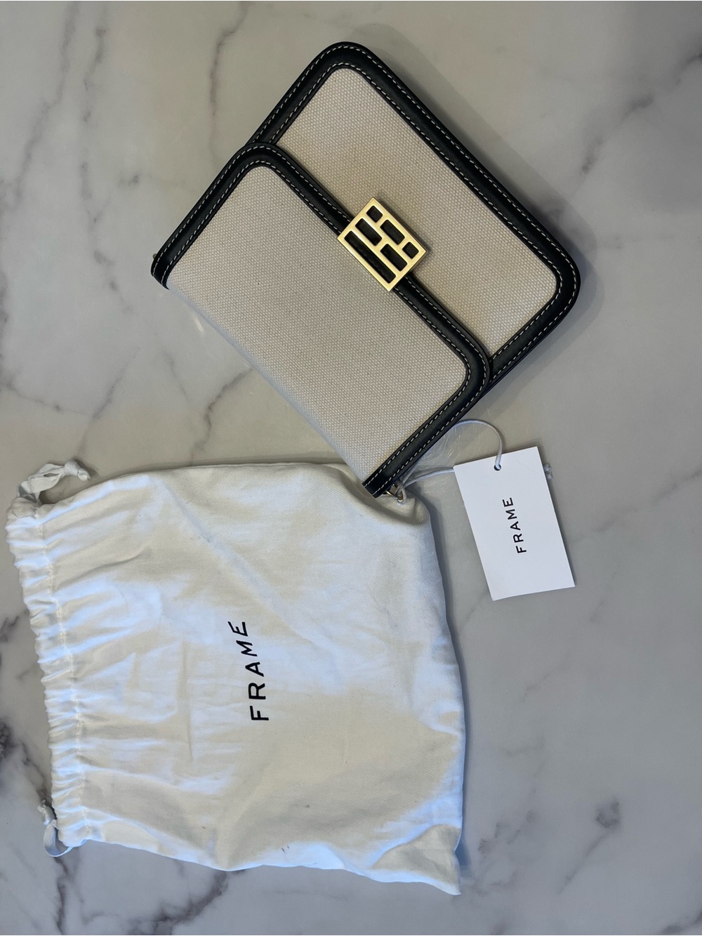 Frame Denim Cream Canvas Crossbody with Black Trim and Gold Accent